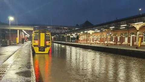 PA Media  Flooding at Wellington station in Shropshire