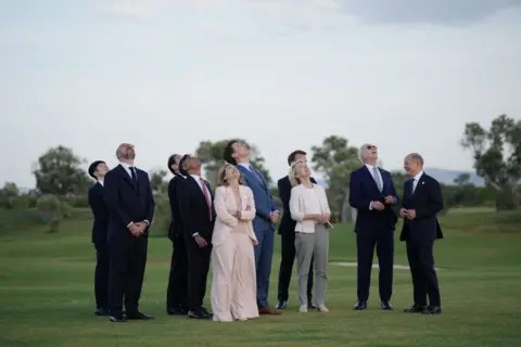 Getty Images G7 leaders look up to the sky