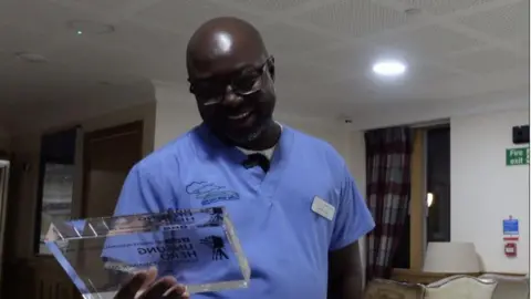 James Dunn/BBC Lamin Faal collects BBC Unsung Hero award