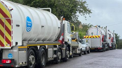 Water tankers parked on a roadside in Swindon