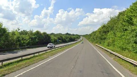 Google A Google Street View image of the A41 on a bright sunny day. Several vehicles can be seen.