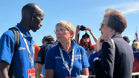 Benjamin Mutua and Julie Longden meeting Princess Anne at the Island Games opening ceremony.