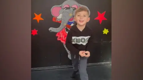 Joshua dancing and singing - representation  taken from a household  video