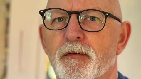 British Transport Police A selfie of a man with a white beard and glasses