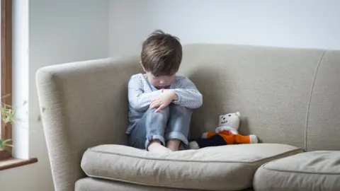 Getty Images boy on sofa