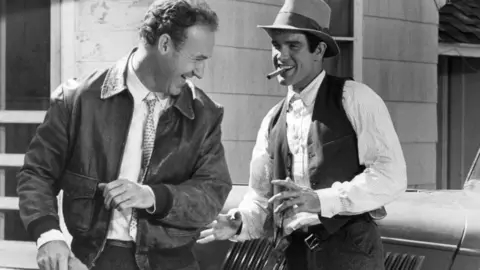 Getty Images Hackman (left) and Warren Beatty laugh in a scene from 1967 film Bonnie and Clyde