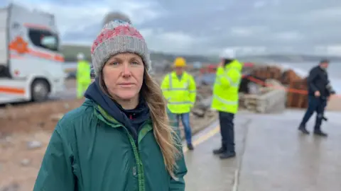 Natalie Cordrey is in a striped grey hat on the A379 Slapton Line 