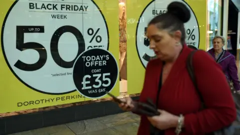 Getty Images Woman on phone at Manchester Trafford Centre