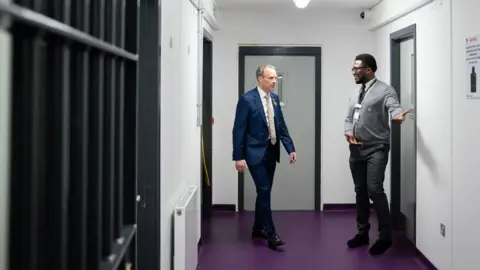 Joe Giddens/PA Wire Deputy Prime Minister and Justice Secretary Dominic Raab is given a tour of category C prison HMP Five Wells in Wellingborough