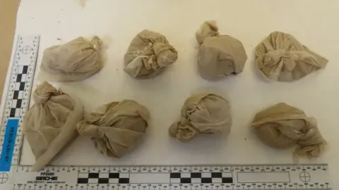 Devon and Cornwall Police Heroin parcels seized from the gang by police