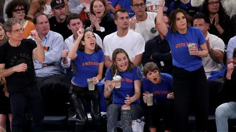 AFP via Getty Images Alana Haim, Este Haim, Taylor Swift, and Mariska Hargitay be  Game Four of the 2026 NBA Finals betwixt  the San Antonio Spurs and the New York Knicks astatine  Madison Square Garden.
