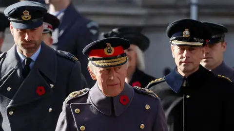 Getty Images Prince William and Prince Edward stand behind the King during the ceremony