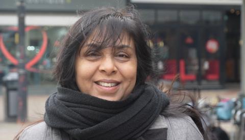 Rasna Patel, wearing a scarf, smiling at the camera in Harlow town centre