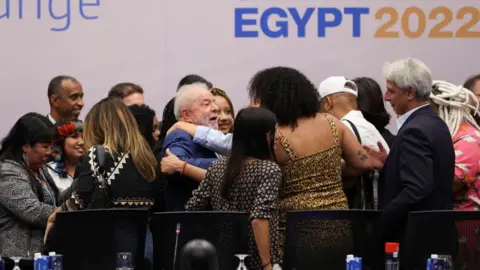 Reuters Brazil's president-elect (centre), pictured at the conference on Thursday