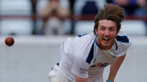 Yorkshire's George Hill bowls a delivery