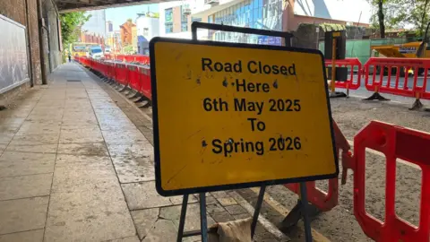 LDRS A yellow road sign which reads: "Road closed here from 6th May 2025 to Spring 2026".