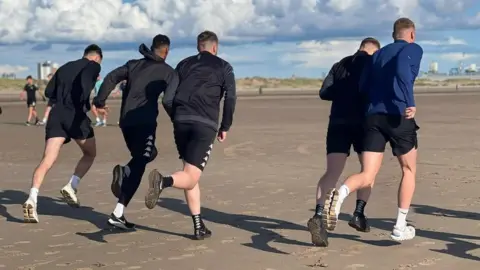 Southport FC Players training on Crosby Beach
