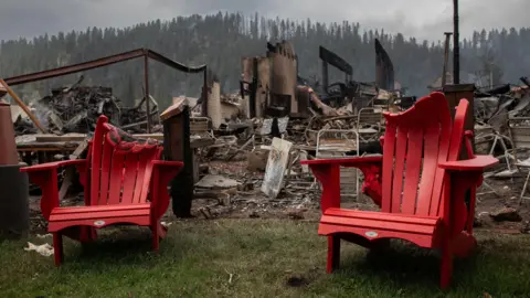 Reuters Melted chairs outside the gutted Maligne Lodge