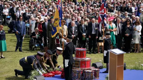 PA Media Military personnel lay wreaths during a service to mark the 40th anniversary of the liberation of the Falkland Islands at the National Memorial Arboretum in Alrewas, Staffordshire.