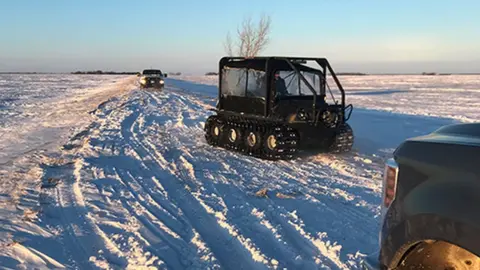 RCMP Manitoba Police used snowmobiles and all-terrain vehicles to navigate the deep snow