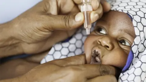 Getty Images An African Baby Receiving a Vaccine