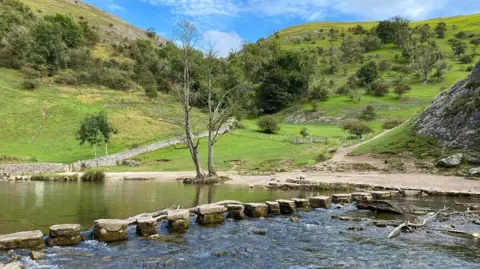 Getty Images Stepping stones across the River Dove at Dovedale in the Peak District National Park in Derbyshire