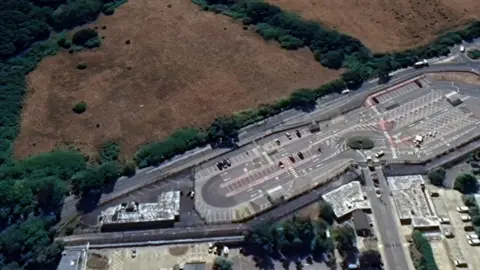 A map of the AWE site, with a car park on one side and a field on the other.