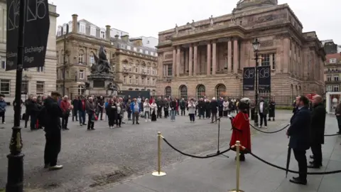 A group of people stood on Exchange Flags in Liverpool