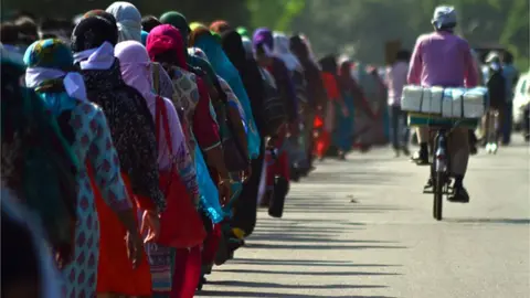 Getty Images Assistant teachers protesting job losses in Allahabad in Uttar Pradesh in 2017