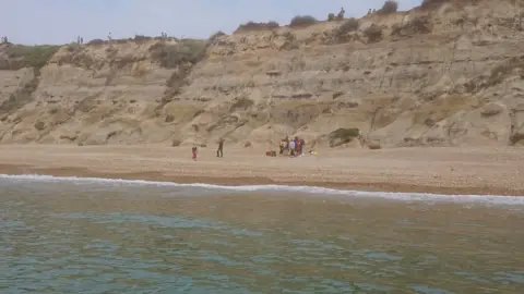 RNLI Mudeford lifeboat Recue scene at Hengistbury Head