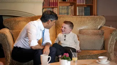 PA Media Rishi Sunak and Dáithí Mac Gabhann