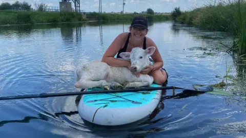 Vicky Hamilton Calf on paddleboard