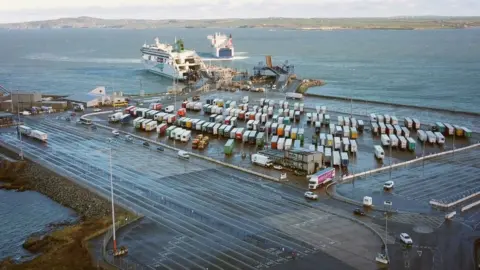 AFP Irish ferries roll on roll off ferry Ulysses unloads as Stena Adventurer arrives in Holyhead port on 2 January