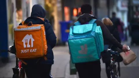 Getty Images Just Eat and Deliveroo employees