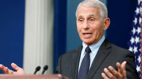 Fauci at a podium