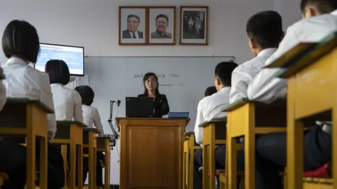 Tariq Zaidi A teacher in front of her class