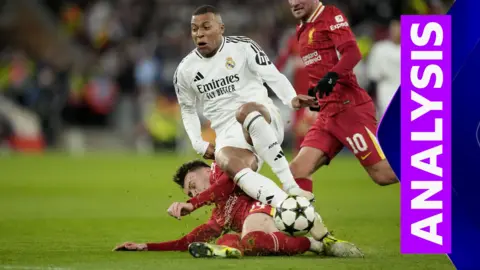 Connor Bradley tackling Kylian Mbappe