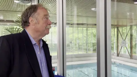 Cllr Simon Myers assessing the partially collapsed ceiling at Active North Yorkshire in Richmond