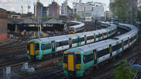 Two Southern trains and a Southeastern train on the approach into London Victoria
