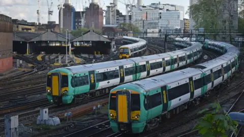 Two Southern trains and a Southeastern train on the approach into London Victoria