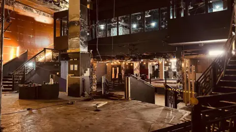 Simon Thake An empty old-fashioned bar in a state of disrepair