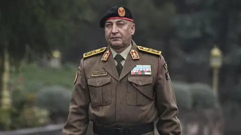 LIbya's army chief Gen Mohammed Ali Ahmed al-Haddad is seen walking during his visit to Ankara, Turkey while wearing a brown army uniform. Photo: 23 December 2025
