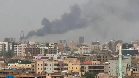 Reuters Plumes of smoke rise during clashes between the paramilitary Rapid Support Forces and the army in Khartoum on 26 September 2024