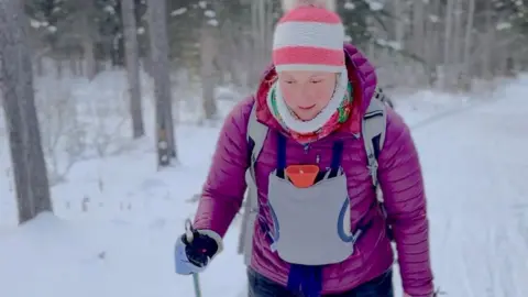 Pavlina Livingstone-Sudrich Pavlina cross country skiing with hot water bottle on her chest