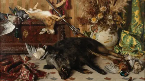 Tennants Auctioneers Dead birds, rabbit and a boar lie around a lavishly decorated room. A riffle is propped against a chest behind the boar.