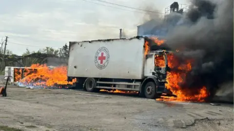 ZELENKSY/TELEGRAM Zelenksy posted this photo of the scene where he says Russian artillery killed three aid workers