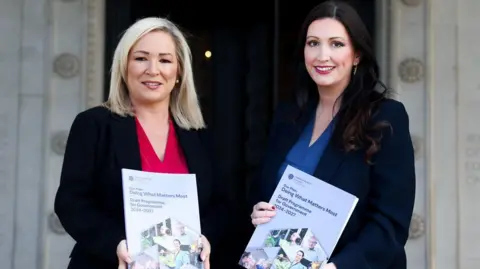 Ni's Executive Michelle O'Neel (left) and Emma Little-Pengli over North Ireland Executive