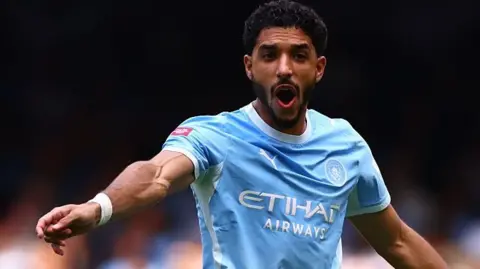 Omar Marmoush shouts and points while playing for Manchester City
