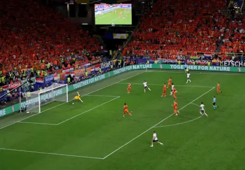 Thilo Schmuelgen/REUTERS England's Ollie Watkins scores a last-minute goal in a Euro semi-final football match against the Netherlands