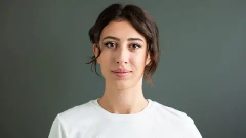 cecilia sala wearing a white top against a grey background